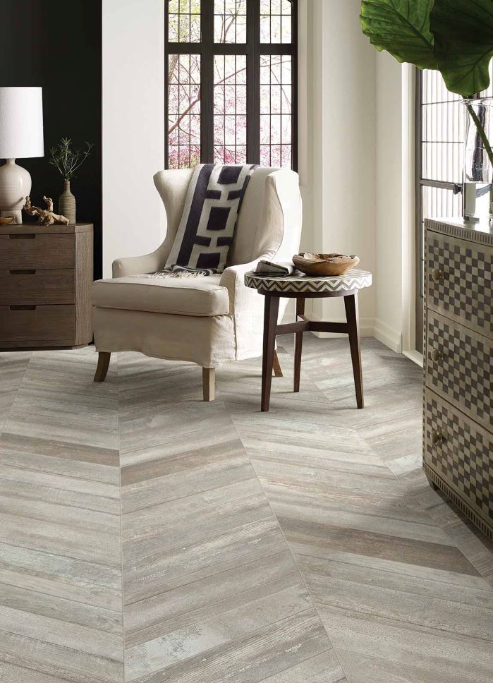 rustic herringbone wood look tile flooring in a earth toned living space