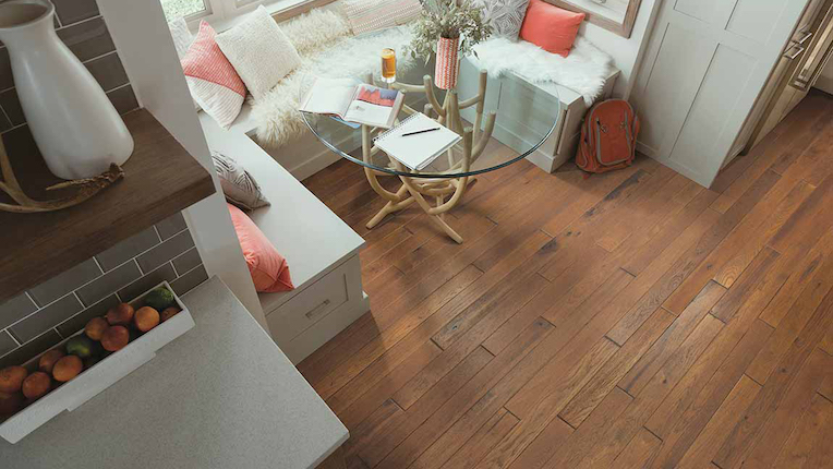 warm hardwood flooring in a spacious kitchen breakfast nook